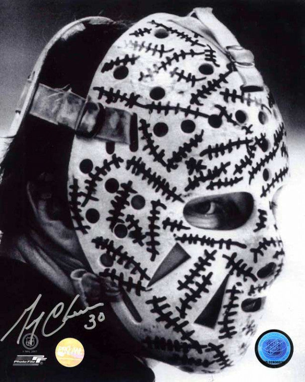 Portrait photo of Gerry Cheevers of the Boston Bruins wearing his famous goalie masks with drawn on 