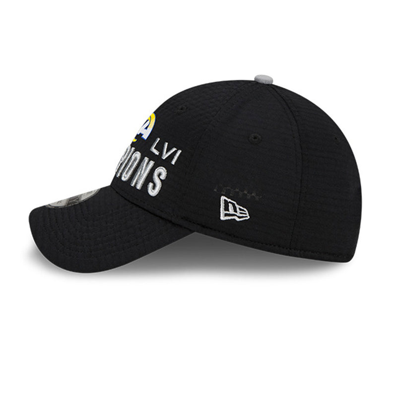 Left side view of Los Angeles Rams Super Bowl LVI Champions 9Forty Snapback cap. Design features bold LA Rams logo and raised silver text  reading "SB LVI CHAMPIONS". Small embroidered New Era logo is visible near the bottom of the panel to the side of the brim. 