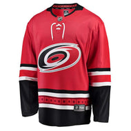 Front view of replica red Carolina Hurricanes NHL home jersey with white and black bands on sleeves and hem, and laces on collar