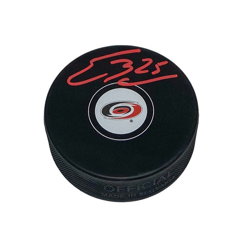 Black hockey puck with Carolina Hurricanes logo signed by Ethan Bear in red ink.