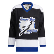 Front view of the  1992 Tampa Bay Lightning jersey featuring black, white and blue colour blocking with large embroidered Tampa Bay Lightning logo with circle and large lightning bolt.