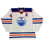 Front view of Kevin Lowe Edmonton Oilers Signed White adidas Vintage Pro Jersey w/Inscription with alternate captain's "A" on the front chest. 