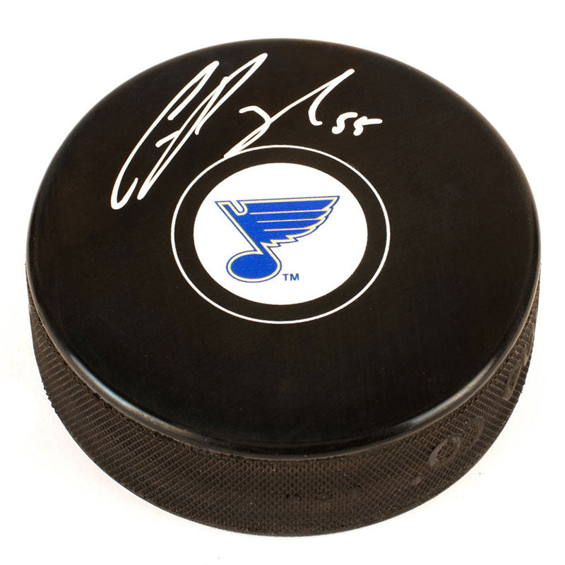 Black NHL hockey puck with  St. Louis Blues logo in centre of front, signed by Colton Parayko. 