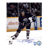 Autographed 8x10 photo of Mike Peca in Edmonton Oilers uniform, with a descriptive plate and Oilers pin.