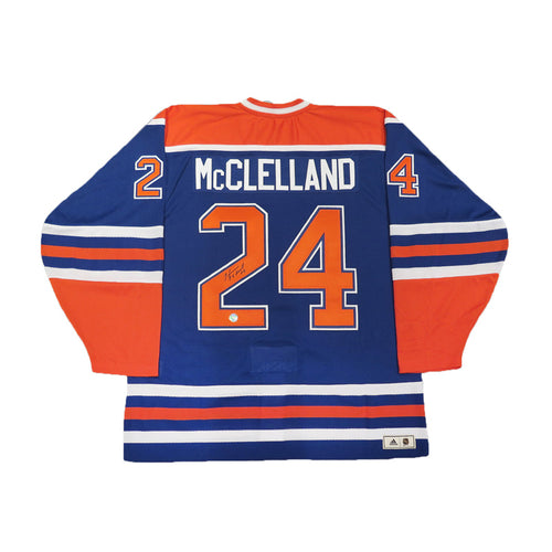 Back view of signed Edmonton Oilers vintage royal blue jersey with Kevin McClelland's name bar and autographed jersey numbers