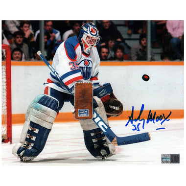 Hockey goalie in action with a signature on the photo