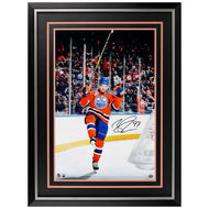 Framed hockey player in action with a Connor McDavid autograph on a white background