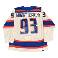 Autographed Hockey jersey with 'Nugent-Hopkins' and number '93' on a white background