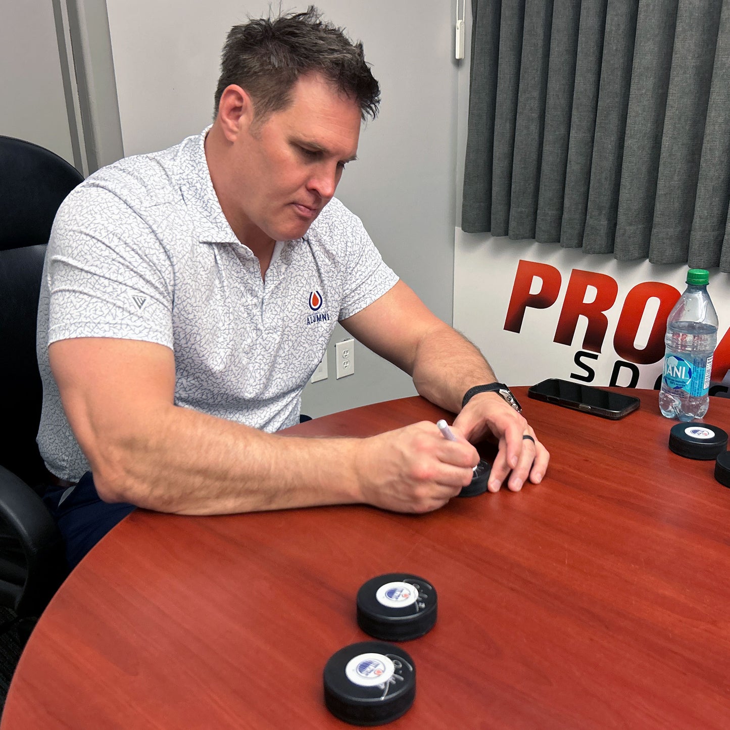 Louie DeBrusk Signed Edmonton Oilers Mid Size Logo Puck
