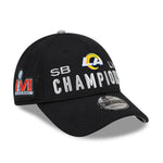 Angled right view of Los Angeles Rams Super Bowl LVI Champions 9Forty Snapback cap. Design features bold LA Rams logo and raised silver text  reading "SB LVI CHAMPIONS". Red LVI Superbowl logo is visible on the right side of the hat. 