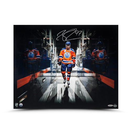 Signed photo of Connor McDavid wearing the orange Edmonton Oilers home jersey with a tunnel effect from the photo editing.