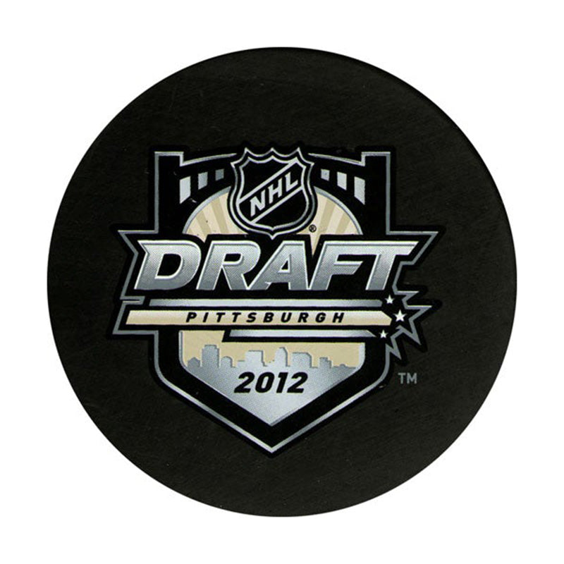 Front view of black hockey puck featuring official NHL 2012 Pittsburgh Draft Puck design