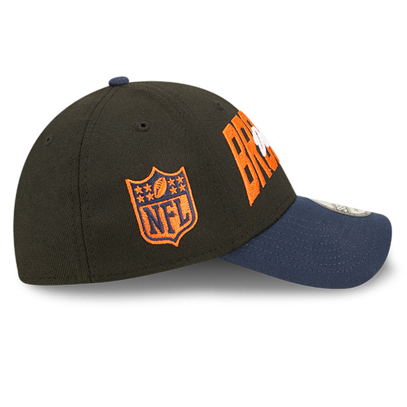 Right side view of 2022 Denver Broncos NFL Draft cap from New Era. Design features embroidered team name on front panels; body of cap is constructed in black with contrasting team colour brim and embroidery. NFL logo is embroidered on the right side in orange and navy. 