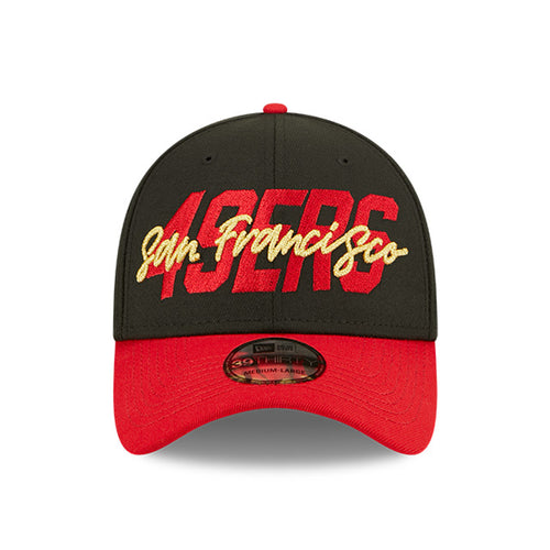 Front view of  of 2022 San Francisco 49ers NFL Draft cap from New Era. Design features embroidered team name on front panels; body of cap is constructed in black with contrasting team colour brim and embroidery.