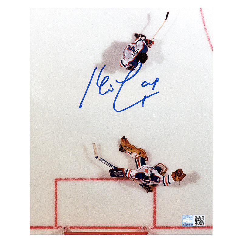 Overhead shot of Kevin Lowe and Grant Fuhr during an Edmonton Oilers NHL hockey game. Image is signed by Kevin Lowe in blue ink.