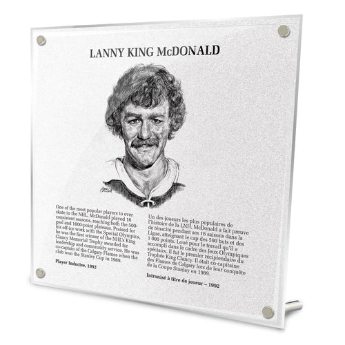 Front view of replica Hockey Hall of Fame plaque of Lanny King McDonald, featuring black and white illustrated portrait and biography in English and French. Made from acrylic with metal hanging hardware