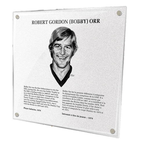 Photo of acrylic replica of Bobby Orr's plaque in the NHL Hockey Hall of Fame. Plaque design features illustrated portrait of Orr, as well as a biography in french and english. 