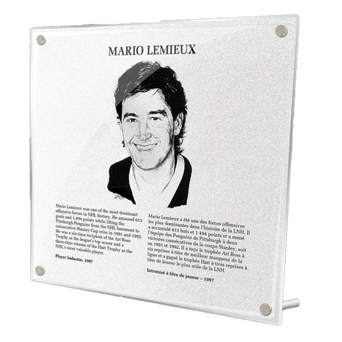 Photo of acrylic replica of Mario Lemieux's plaque in the NHL Hockey Hall of Fame. Plaque design includes black and white illustrated portrait of Lemieux, as well as biography in French and English. 