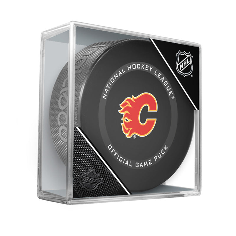 Front view of black hockey puck with official NHL game puck text and Calgary Flames logo in centre. Displayed in a clear acrylic puck case with NFL shield in the top corner. 