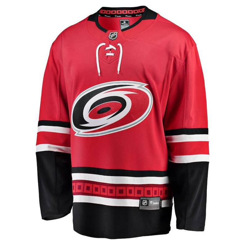 Front view of replica red Carolina Hurricanes NHL home jersey with white and black bands on sleeves and hem, and laces on collar