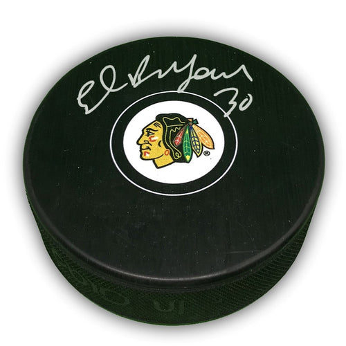 Black hockey puck with Chicago Blackhawks logo, autographed by Ed Belfour in silver ink