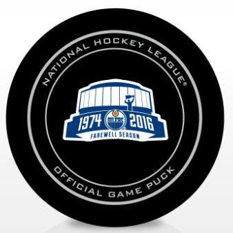 Black NHL official game puck featuring the Edmonton Oilers 1974-2016 Farewell Coliseum design on the front center