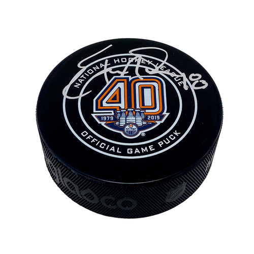 Edmonton Oilers 40th Anniversary official NHL souvenir puck signed by Ethan Moreau in silver ink on the top half of the puck face. 