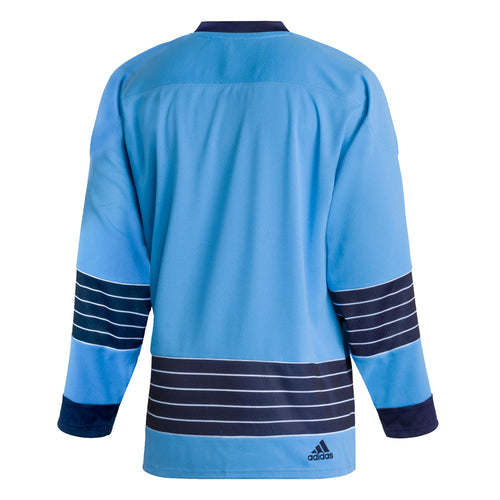 Backview of adidas vintage team classics 1967 Pittsburgh Penguins jersey, featuring blue and white striping on sleeves and lower hem. Small embroidered adidas logo on the bottom right hem. 