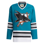 Front view of the adidas vintage team classics  1991 San Jose Sharks jersey featuring bright teal body and logo of shark biting a hockey stick. Sleeves and lower hem featuring black. light grey and white stripes 