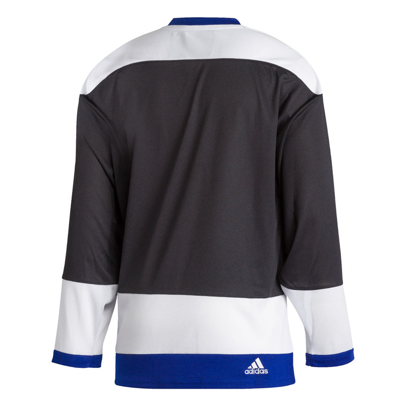 Back view of the 1992 Tampa Bay Lightning jersey featuring black, white and blue colour blocking. There is a small embroidered adidas logo near the bottom right hem. 