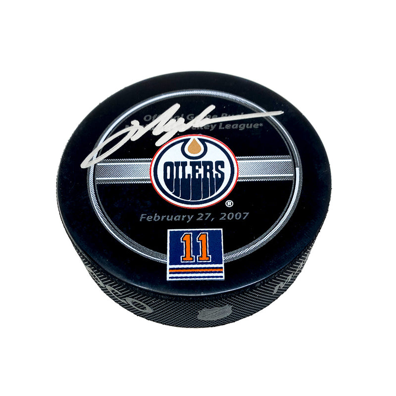 Black hockey puck with Mark Messier retirement night official NHL game puck design. Puck is signed by Mark Messier in silver ink. 