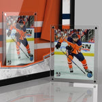 All Star Jersey Show Case framing system Magnetic Photo Frame displayed in case with jersey and outside of case, holding an image of Jujhar Khaira skating during an Edmonton Oilers NHL hockey game