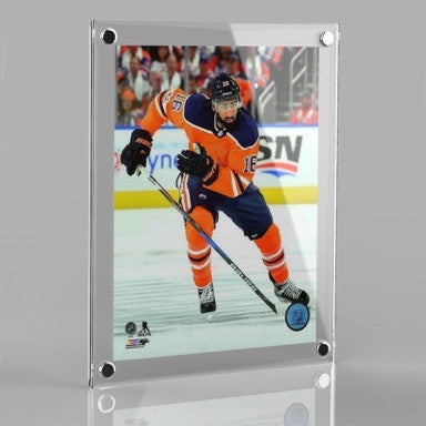 All Star Jersey Show Case framing system Magnetic Photo Frame shown outside of case, holding an image of Jujhar Khaira skating during an Edmonton Oilers NHL hockey game