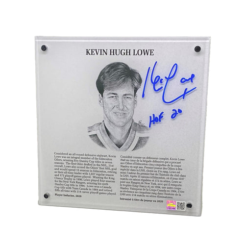 Slightly angled photo of signed acrylic replica of Kevin Lowe's Hockey Hall of Fame plaque. Plaque includes illustrated portrait of Lowe as well as bio in English and French. Plaque is signed by Lowe in the top right corner with "HOF 20" inscription.