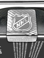 Detail photo of silver NHL hologram seal, shown on acrylic puck display case. Hologram does not include NHL tracking technology.
