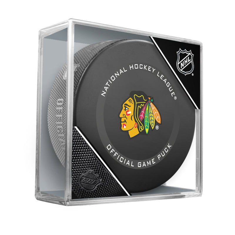 Official 2021-22 Chicago Blackhawks NHL game puck; design features team logo in the centre of the puck face. Puck is shown in clear acrylic puck cube. 