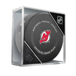 Official New Jersey Devils NHL Game Puck. Puck is shown stored in clear puck cube. 