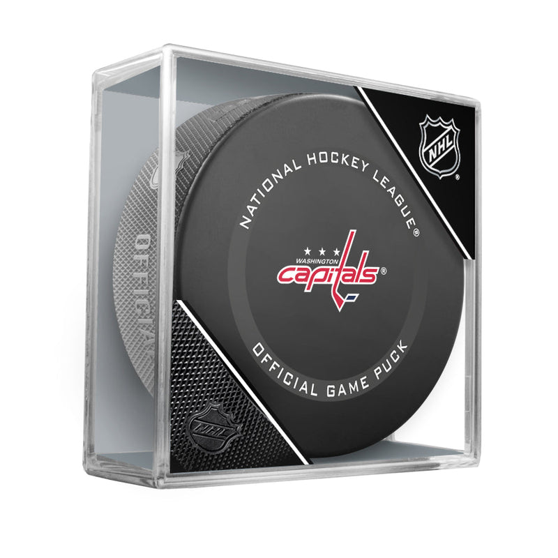 Official 2021-22 Washington Capitals NHL Game puck; puck design features Washington Capitals logo in the centre of the puck face. Puck is shown displayed in clear plastic puck cube. 