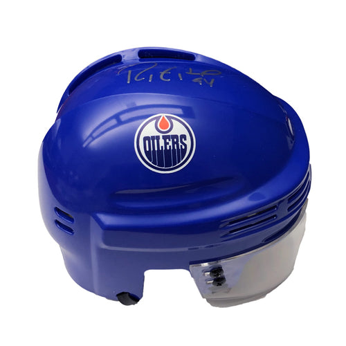 Royal blue mini helmet signed by Ryan Smyth with Oilers logo on the side