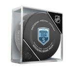 Black hockey puck with official NHL Inaugural Seattle Kraken game puck design. Puck is show in clear puck case. 