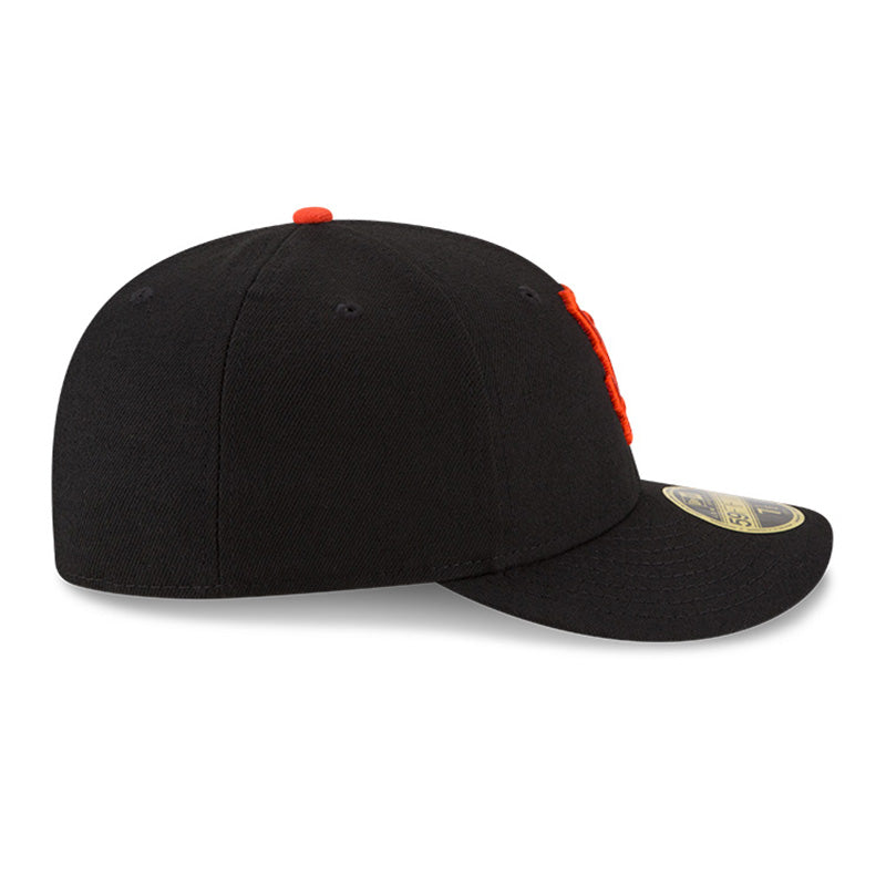 Side view facing right of black San Francisco Giants baseball cap with orange embroidered SF logo on front of low profile 59Fifty fitted baseball cap.