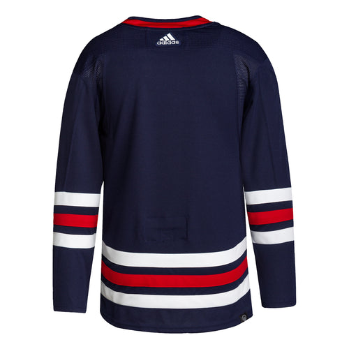 Back view of navy Winnipeg Jets NHL home game jersey, featuring red collar, red and white stripes on sleeves and bottom hem, and adidas logo on top centre back 