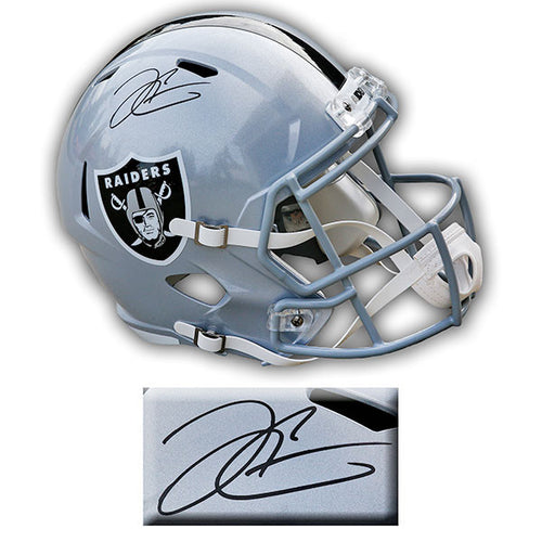 Silver Las Vegas Raiders replica Riddell speed helmet signed by Derek Carr; inset photo showing detail of autograph