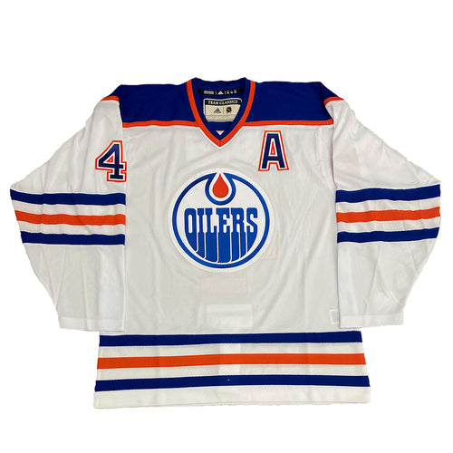 Front view of Kevin Lowe Edmonton Oilers Signed White adidas Vintage Pro Jersey w/Inscription with alternate captain's "A" on the front chest. 