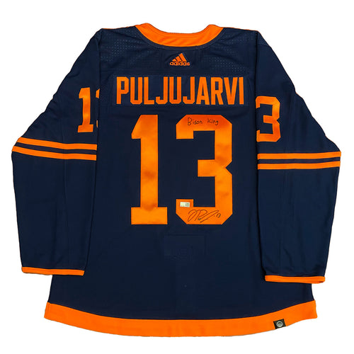 Back view of signed Jesse Puljujarvi Edmonton Oilers Navy adidas jersey. Jersey is signed on the number three in black with "Bison King" inscription. 