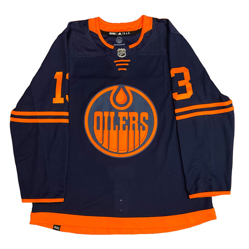 Front view of signed Jesse Puljujarvi Edmonton Oilers Navy adidas jersey. Jersey is signed on the number three in black with "Bison King" inscription.