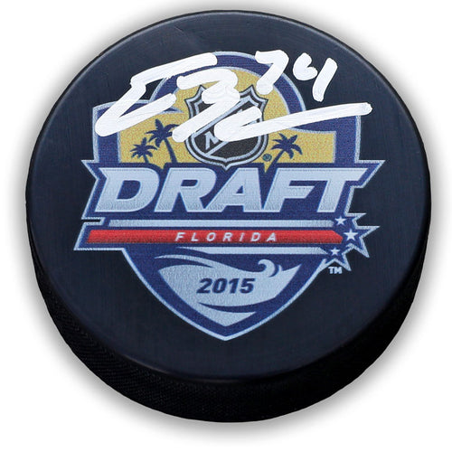 Black NHL hockey puck with 2015 NHL Florida Draft design. Puck is signed by Ethan Bear in white ink. 