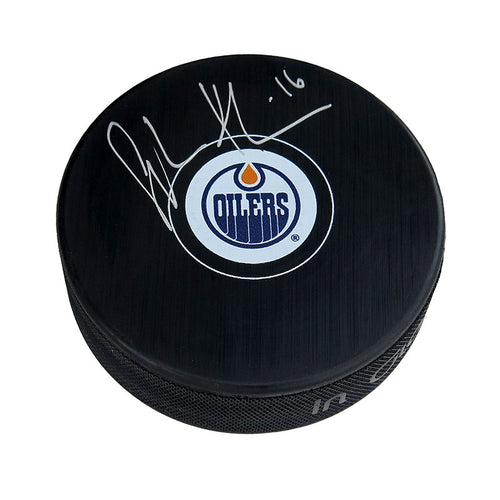Black NHL hockey puck with Edmonton Oilers logo; signed by Jujhar Khaira