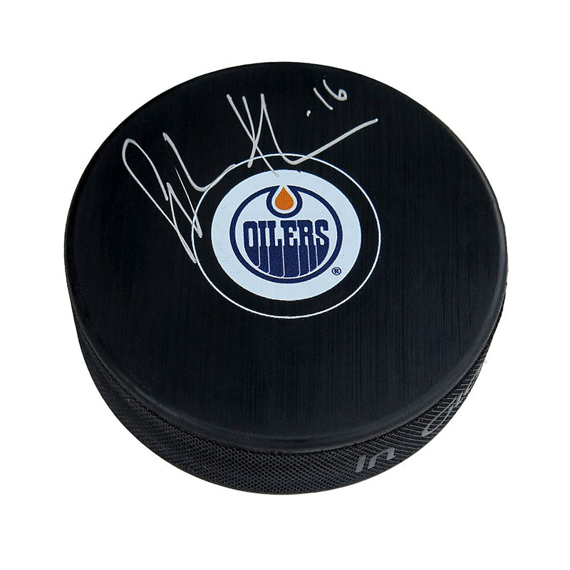 Black NHL hockey puck with Edmonton Oilers logo; signed by Jujhar Khaira