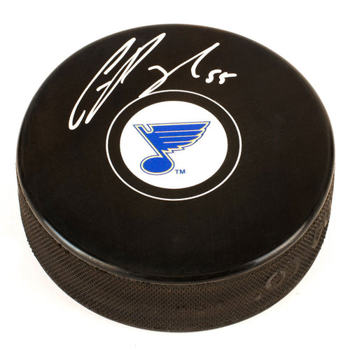 Black NHL hockey puck with  St. Louis Blues logo in centre of front, signed by Colton Parayko. 